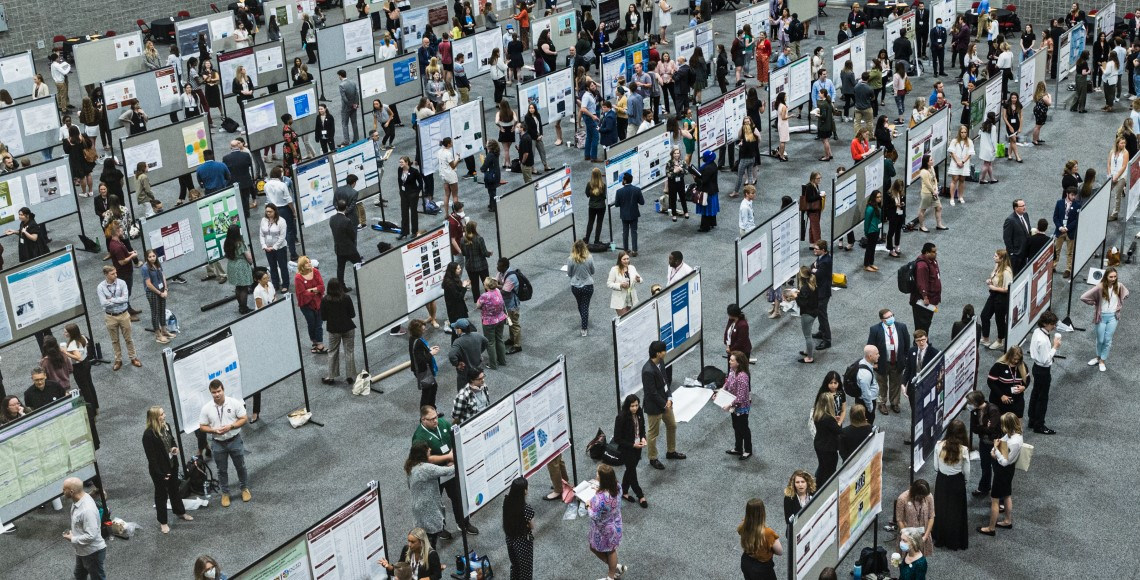 an overhead photo of students presenting posters at Discover USC
