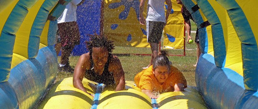 Students enjoy a waterslide during a USC Salkehatchie activity