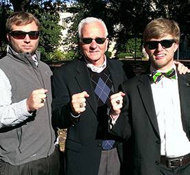 Dan Brown and his 2 children display their Carolina rings.