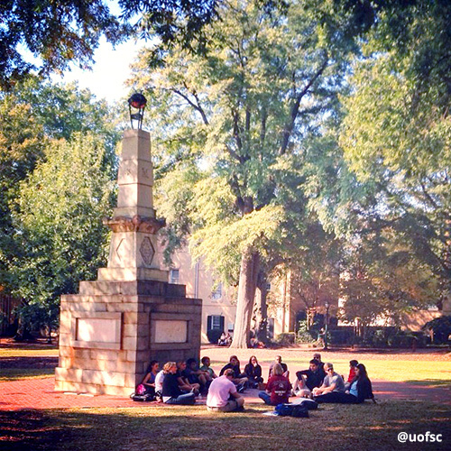 Class meets outside, sitting near Maxcy Monument in the middle of the Horseshoe.