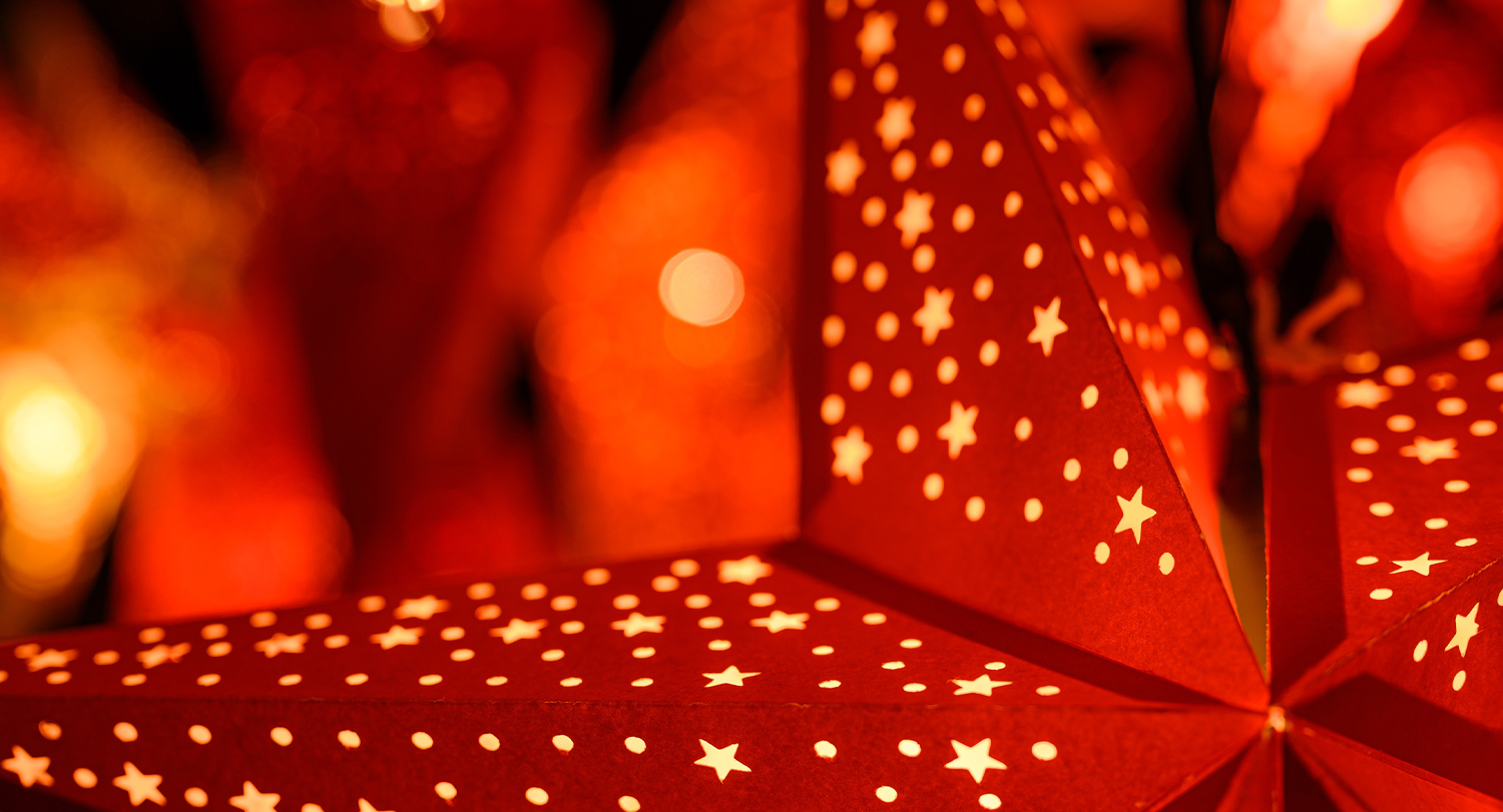 A close up of a red paper lantern star. 