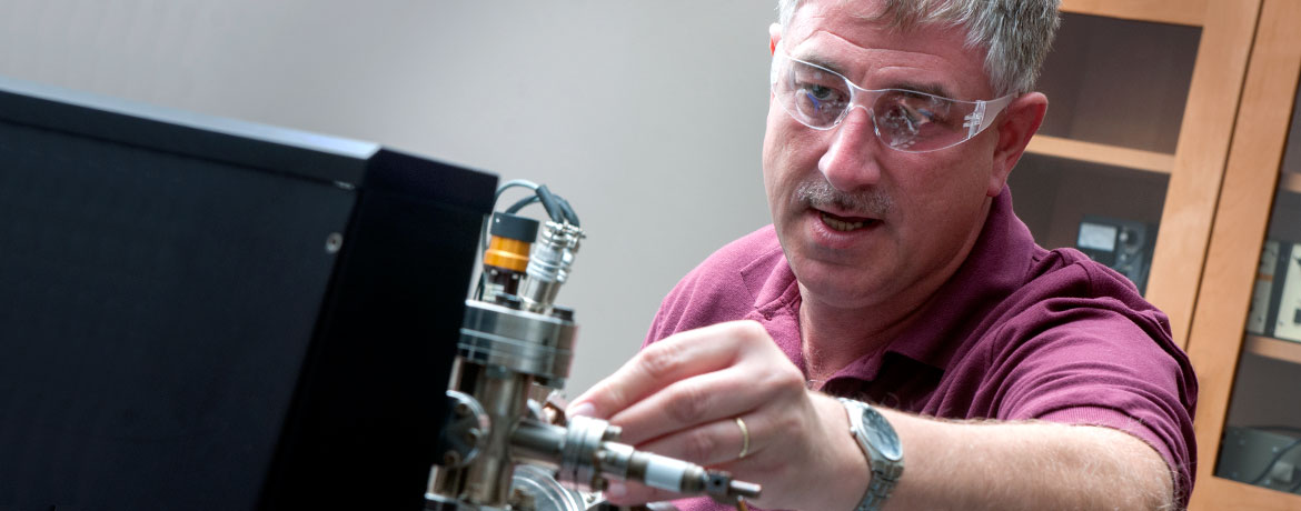 researcher conducting an electrical experiment