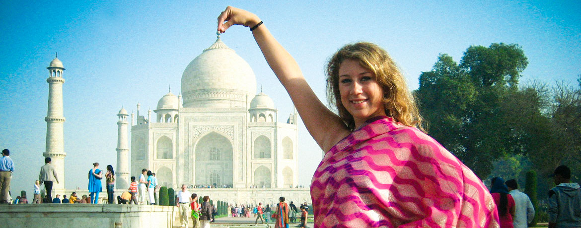 student posing in front of the Taj Mahal