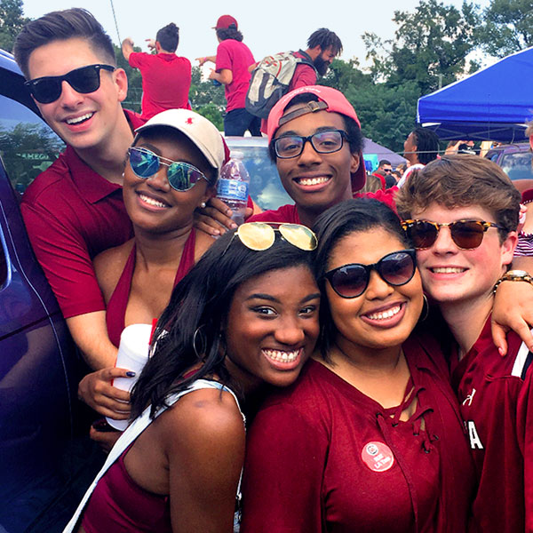 Group of students at a tailgate.