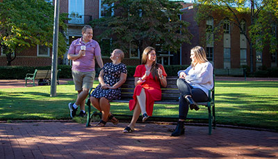 Students talking in a courtyard.