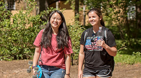 Students walking on campus. 
