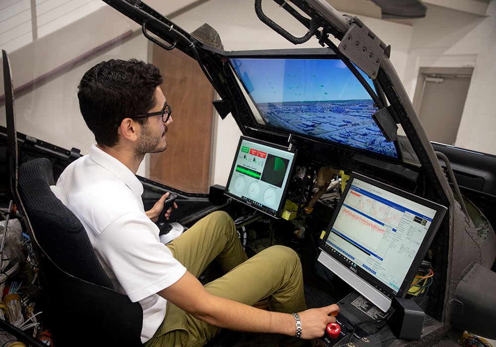 Student in a helicopter flight simulator. 
