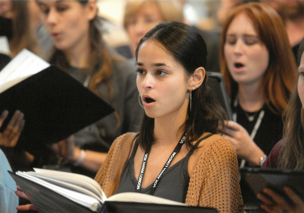a student singing in a choral group
