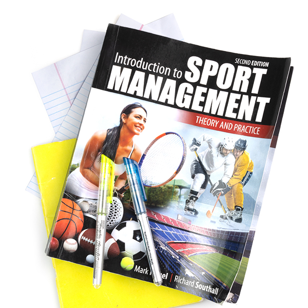Sport management book with paper and pens. 