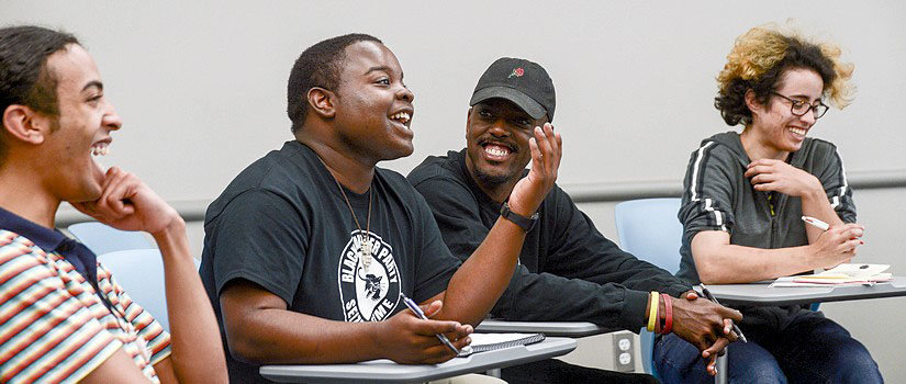 students laughing and smiling in class
