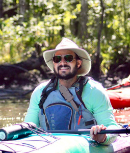 Jay Grant paddling in a kayak.