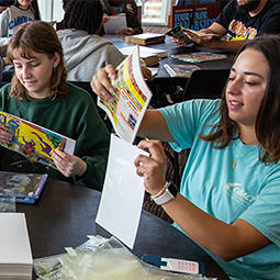 Students looking at Comics in an English class.