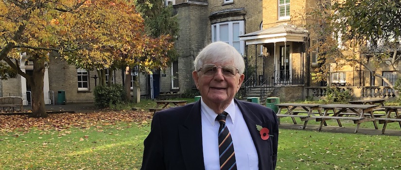 Prof. Julian V. Minghi standing in front of his secondary school, Clapham College, London