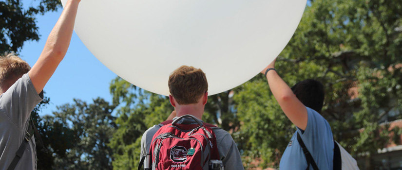 Students launching a weather balloon