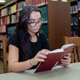 Student studying in the library. 