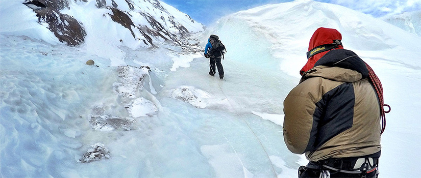 Resaerchers climbing up an icy glacier