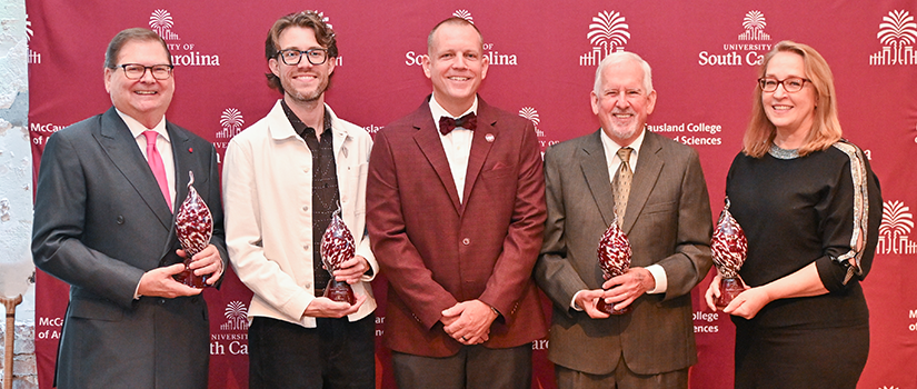 honorees smiling with the Dean at the ROE Awards
