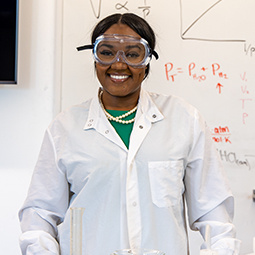 Photo of a research student with equipment.