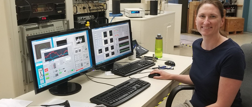 Michelle Passerotti works with the accelerator mass spectrometer at the WHOI AMS Laboratory during her fellowship there in 2018. 