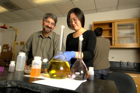A professor and student work in a chemistry lab