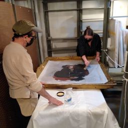 Students restoring a painting from the museum's collection.