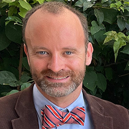 man smiling with suit on