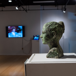 An image of a statue of a woman's head is featured at McMaster Gallery.