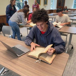 A student reading a book at the Caroliniana Library.