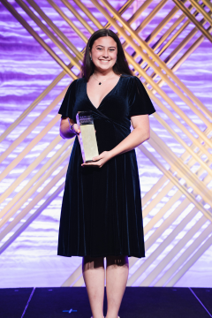 Sarah Hoffman poses with her ADDY Award at the American Advertising Awards.