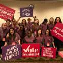 Feminist collective with vote signs