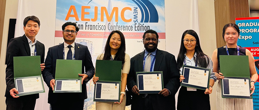 aejmc award winners holding certificates