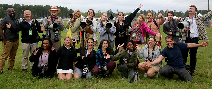 Carolina Cup students post with professional photographers and faculty.