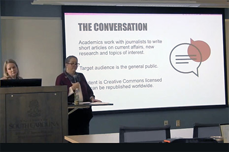 picture of two women making a presentation
