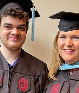 Drew and Kristi Benson in graduation regalia