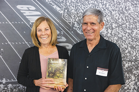 Carol and Jim Alberto, holding a copy of their book, "Dafuskie Daze."