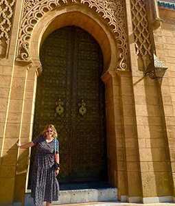Karen Kelly in front of a Moroccan building