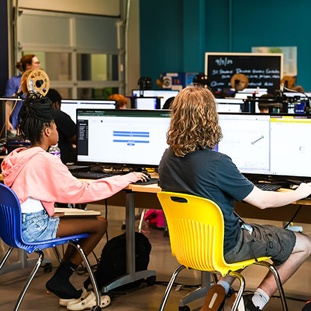 Students working on computers in classroom