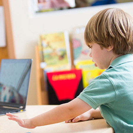 child reaching for objects