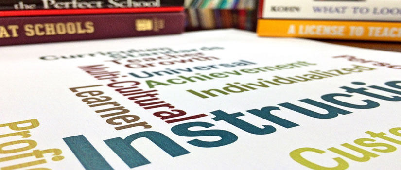 A word cloud amidst some books. The largest words in the cloud are 'Instruction,' 'multi-cultural learner' and 'individual.'