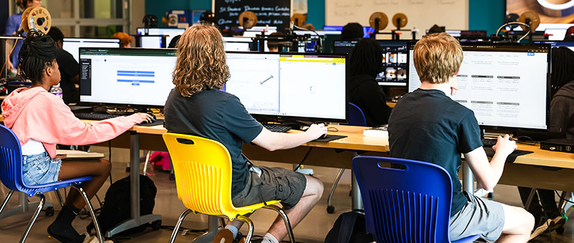 Students working on computers in a classroom
