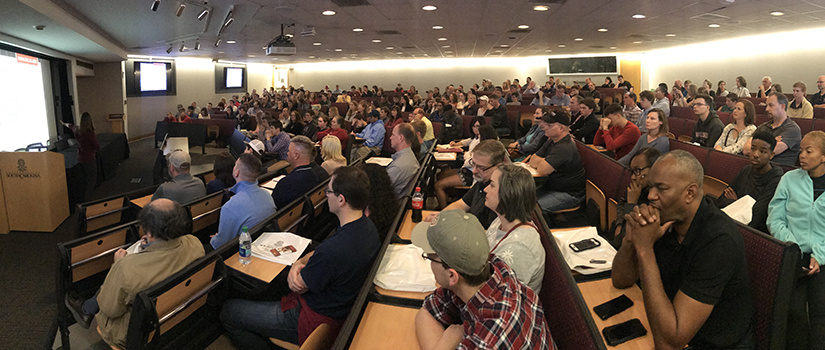 panoramic view of full auditorium for an information session