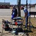 EE students working on project outside, it illustrates a field measurement scenario to characterize wireless communication signal propagation