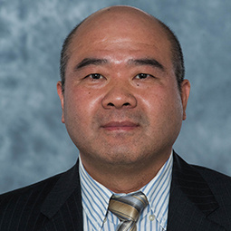 headshot of Professor Chris Xue