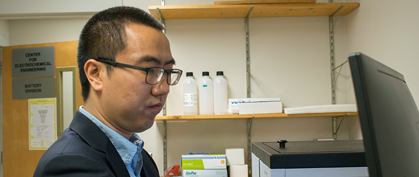 Chang Liu works at a computer in his lab