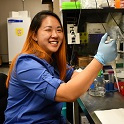 Candice Chung in lab holding pipette