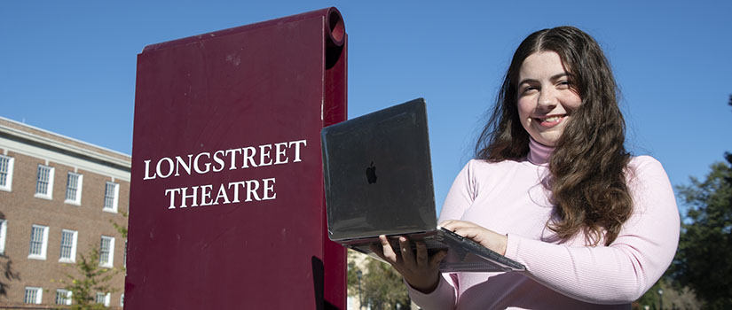 Sara Hendrix next to Longstreet Theatre sign