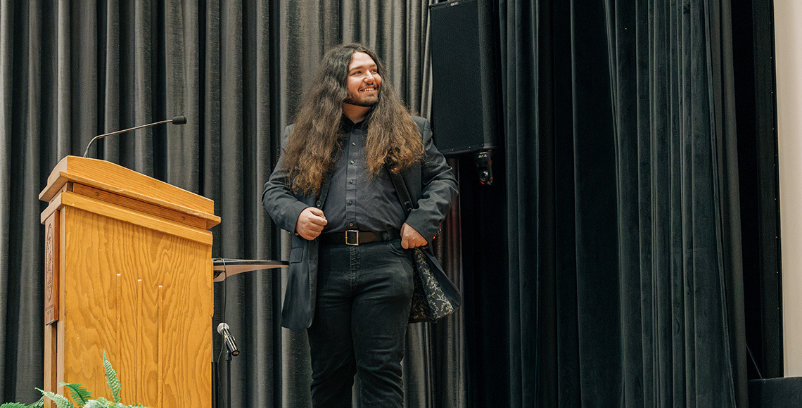 Student on stage smiling