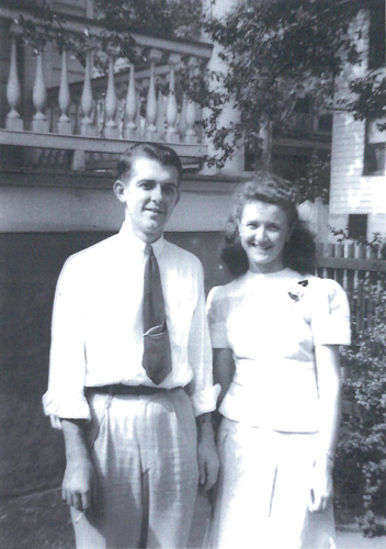 A young man and woman standing next to each other