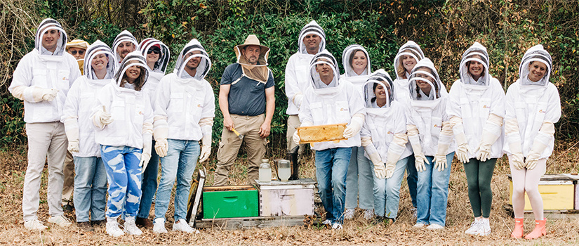 Group photo of the beekeeping class with their instructor.