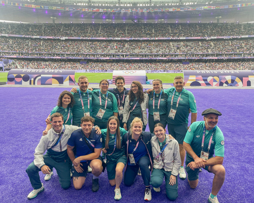 Group photo of Kendall Williams and rugby team at the Paris Olympics